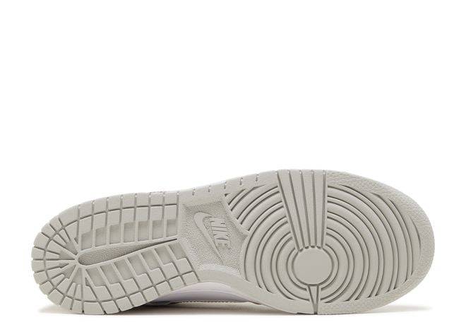 Outsole of Nike Dunk Low SE GS Lottery Pack in grey fog with textured grip pattern for traction and durability.