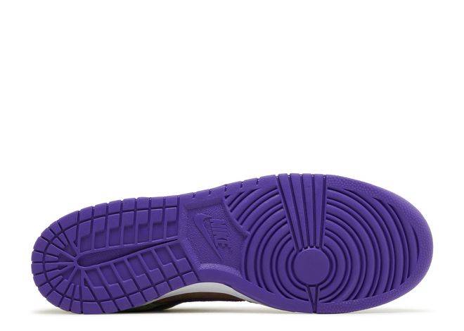 Nike Dunk Low SP Retro Veneer 2024 sneaker outsole in vibrant purple rubber, highlighting traction and durability. Iconic Nike branding visible.