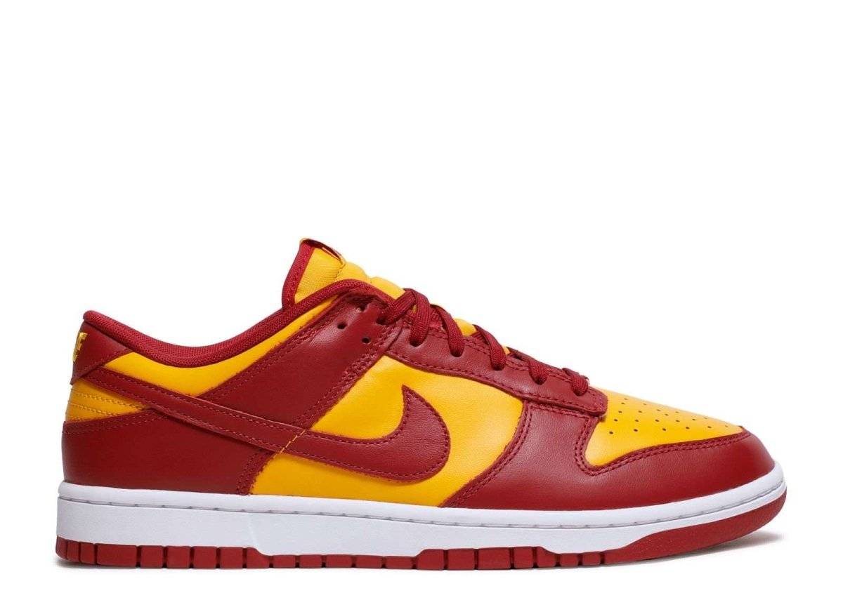 Nike Dunk Low USC sneakers featuring a leather upper in vibrant red and yellow, with a white rubber outsole. Official USC colors, released November 2022.