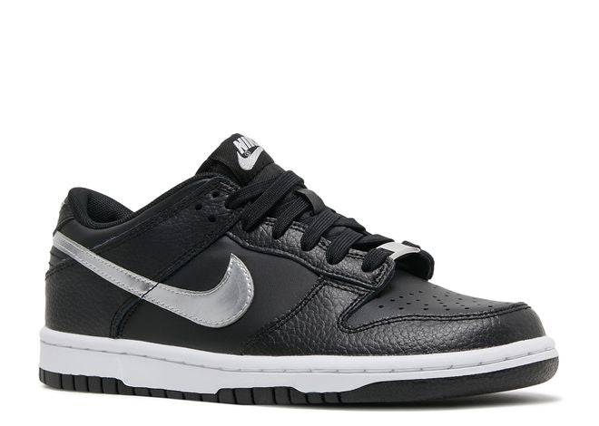 Nike Dunk Low NBA 75th Anniversary sneaker featuring black leather upper, silver Swoosh, and durable white and black sole design.