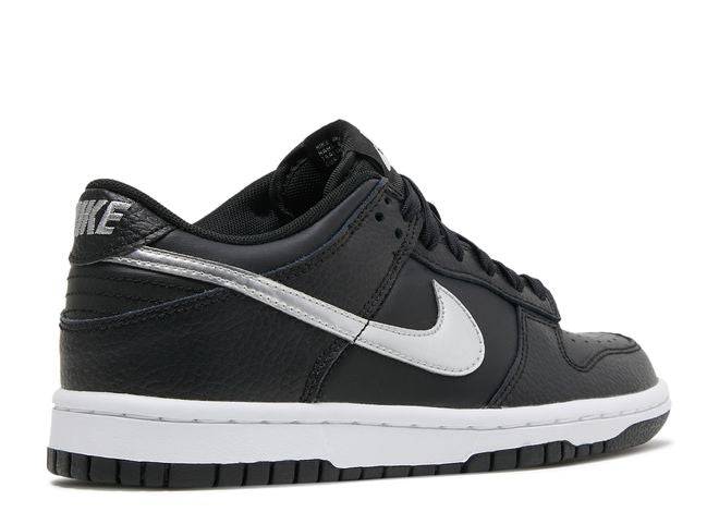 Side view of NBA Dunk Low 75th Anniversary - Nike Spurs sneaker with black leather, silver Swoosh, and white midsole.