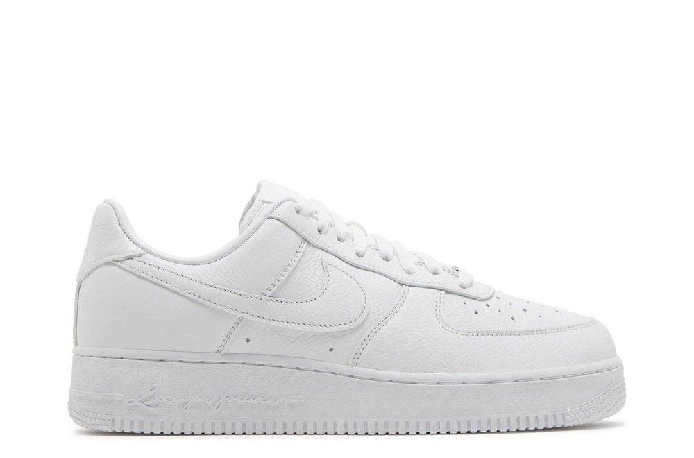 NOCTA x Air Force 1 Low Certified Lover Boy sneaker in white leather with 'Love You Forever' script on the midsole, side profile view.