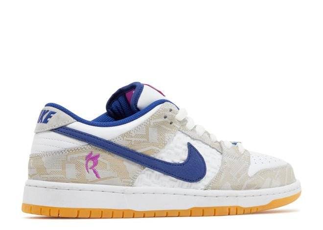 Opposite side view of Rayssa Leal Dunk Low SB sneaker in Deep Royal Vivid Purple with beige patterns, white base, and pink branding.