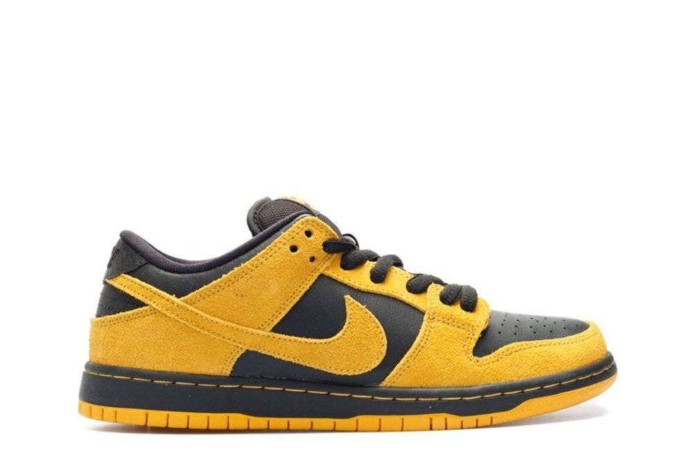 SB Dunk Low Pro Iowa Nike sneakers in vibrant yellow and black colorway, featuring a suede upper and durable sole. Perfect for casual and sporty looks.