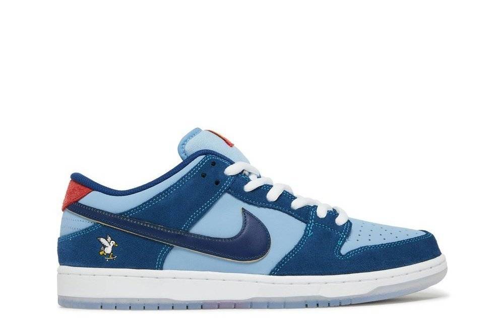 Nike SB Dunk Low Why So Sad sneaker featuring coastal blue leather and suede, skateboard chicken embroidery, and Fat-style SB lacing.