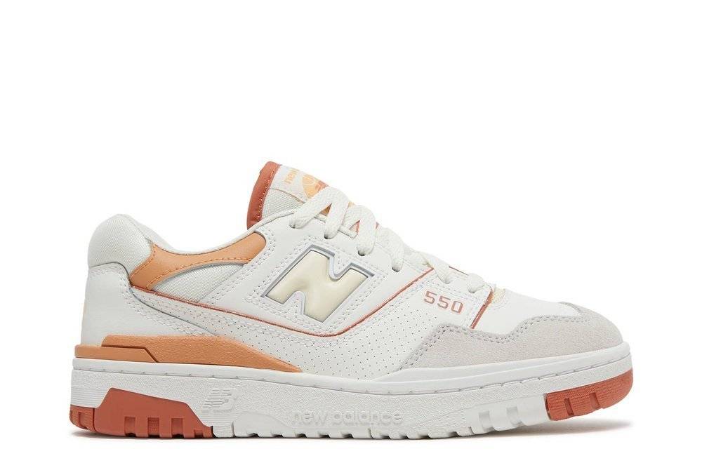 Wmns 550 Au Lait sneaker by New Balance, featuring a cushioned design, gum rubber sole, and neutral beige and orange tones. Perfect for walking and exercise.