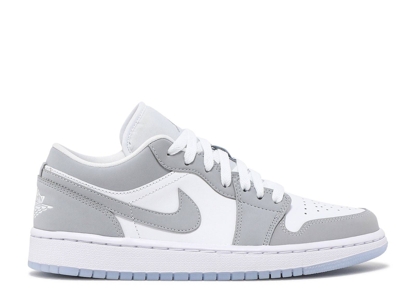 Women's Air Jordan 1 Low in White and Wolf Grey featuring white leather upper, Wolf Grey Durabuck overlays, translucent outsole, and Jordan Wings logo.