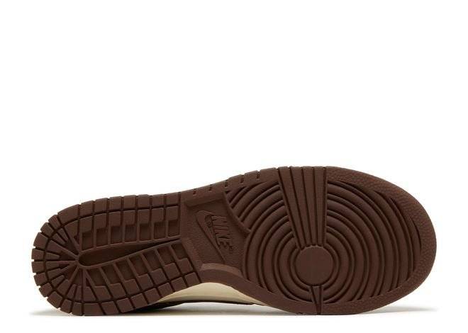 Outsole view of Nike Wmns Dunk Low Cacao Wow sneakers featuring a durable brown rubber sole with circular traction pattern.