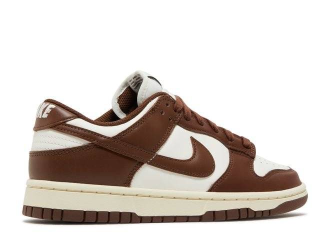 Rear side view of Nike Wmns Dunk Low Cacao Wow sneakers with brown leather detailing, white heel tab, and Nike branding.