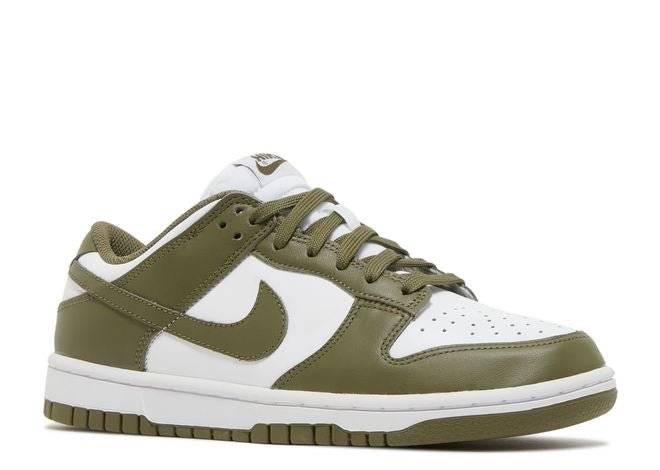 Side angle of Nike Dunk Low Medium Olive Women's sneaker showcasing olive green leather overlays and white paneling with a durable rubber sole.