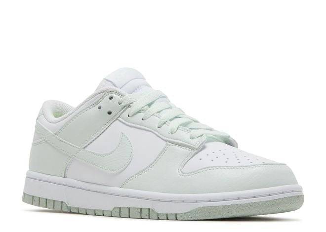 Nike Dunk Low Next Nature Mint sneaker with white leather upper, mint green overlays, and laces, showcasing eco-friendly craftsmanship.