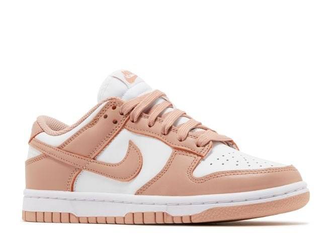 Side view of the women's Nike Dunk Low Rose Whisper sneaker featuring a two-tone leather upper and cushioned EVA foam sole.