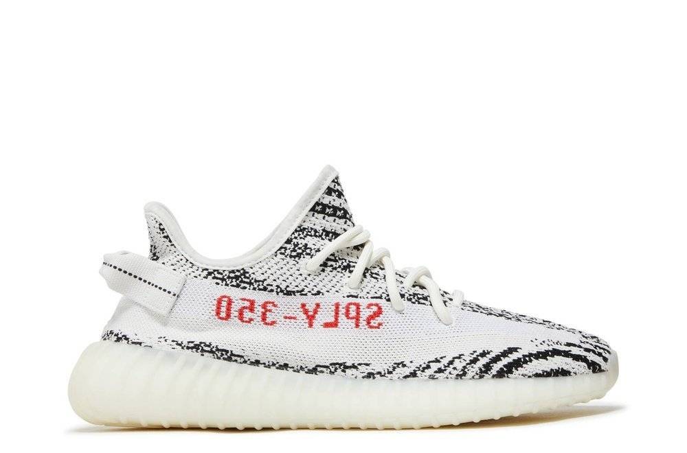 Yeezy Boost 350 V2 Zebra 2023 sneaker featuring a white and black Primeknit upper with red 'SPLY-350' text and a Boost sole for comfort.