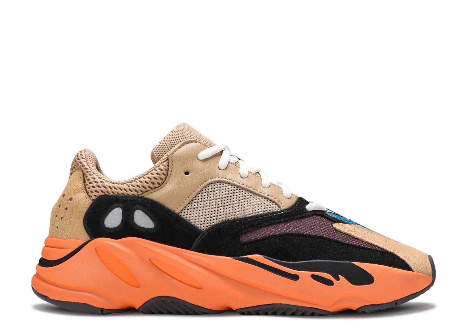 Yeezy Boost 700 Enflame Amber sneaker featuring a mesh, leather, and suede upper with vibrant overlays and a bright orange Boost sole.