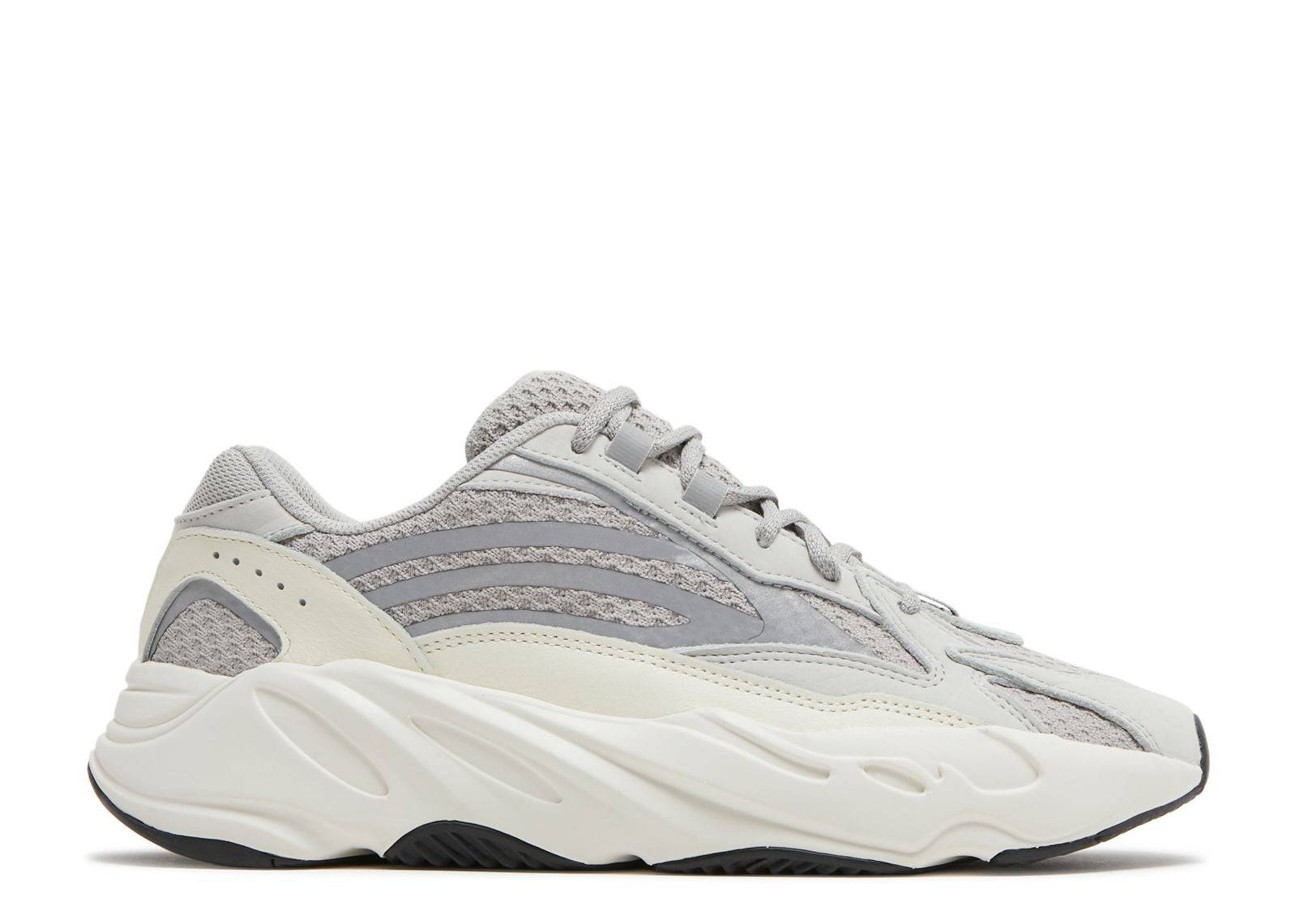 Yeezy Boost 700 V2 Static sneaker featuring a grey mesh upper with white leather overlays, reflective accents, and a chunky black and white sole.