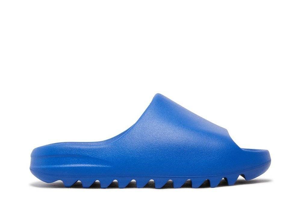 Yeezy Slides Azure by Adidas in vibrant blue color, featuring sleek EVA foam construction for casual comfort and bold streetwear style.