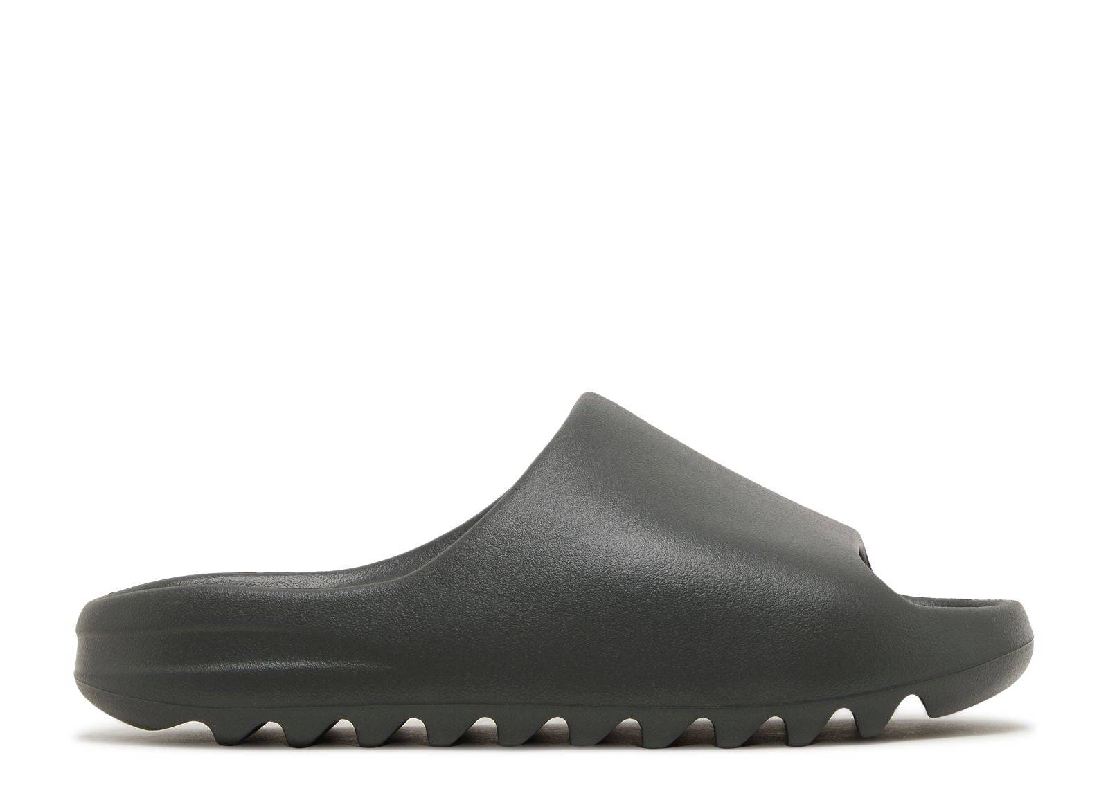 Yeezy Slides Dark Onyx in minimalist dark onyx color with a sleek, slip-on design and ridged sole for comfort and style.