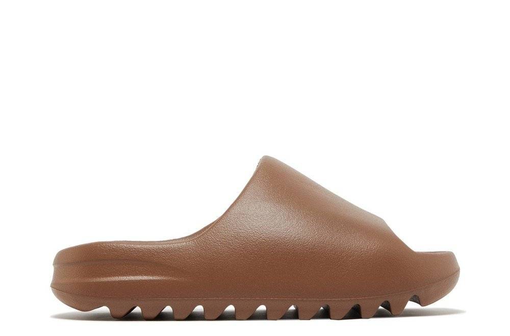 Yeezy Slides Flax in Flax brown color, featuring a minimalist design with EVA-injected lightweight mold and ridged outsole for grip.