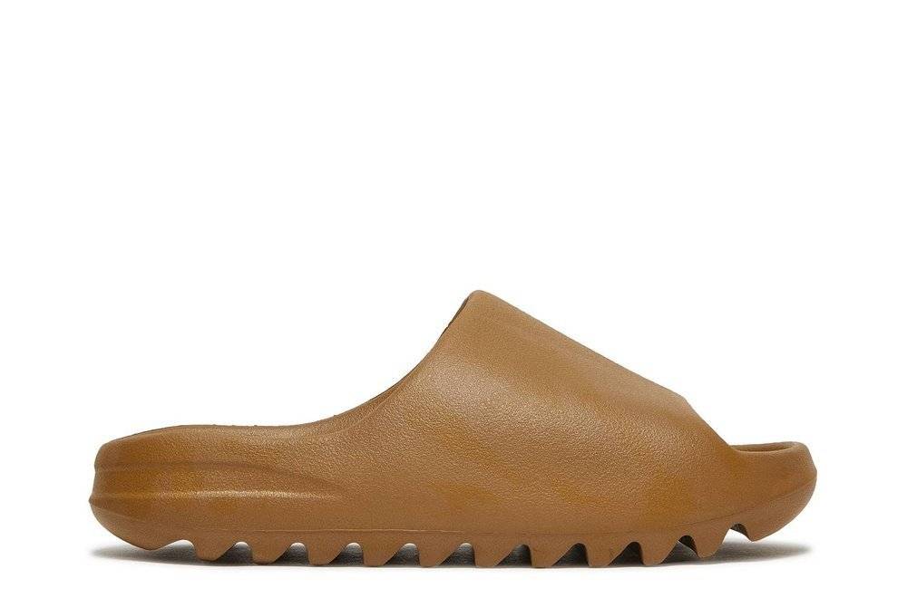 Yeezy Slide Ochre in brown EVA foam with a minimalist design, soft footbed for comfort, and deep tread outsole for traction.