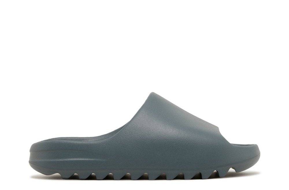 Yeezy Slides Slate Marine featuring a sleek slate blue design with a textured sole for comfort and style. Perfect for casual wear, released August 11, 2023.